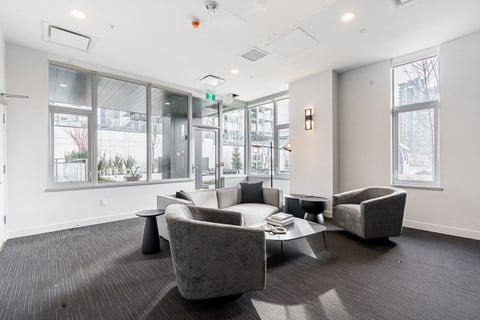 a living room with couches and chairs and a table